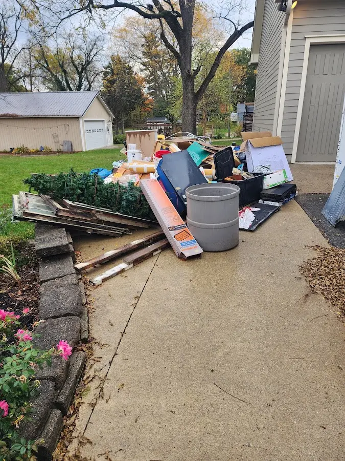 Dumpster being loaded with debris for Demolition Dumpster Rental in Canonsburg